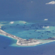 Chinese dredging vessels are purportedly seen in the waters around Mischief Reef in the disputed Spratly Islands in the South China Sea in this still image from video taken by a P-8A Poseidon surveillance aircraft provided by the United States Navy May 21, 2015.